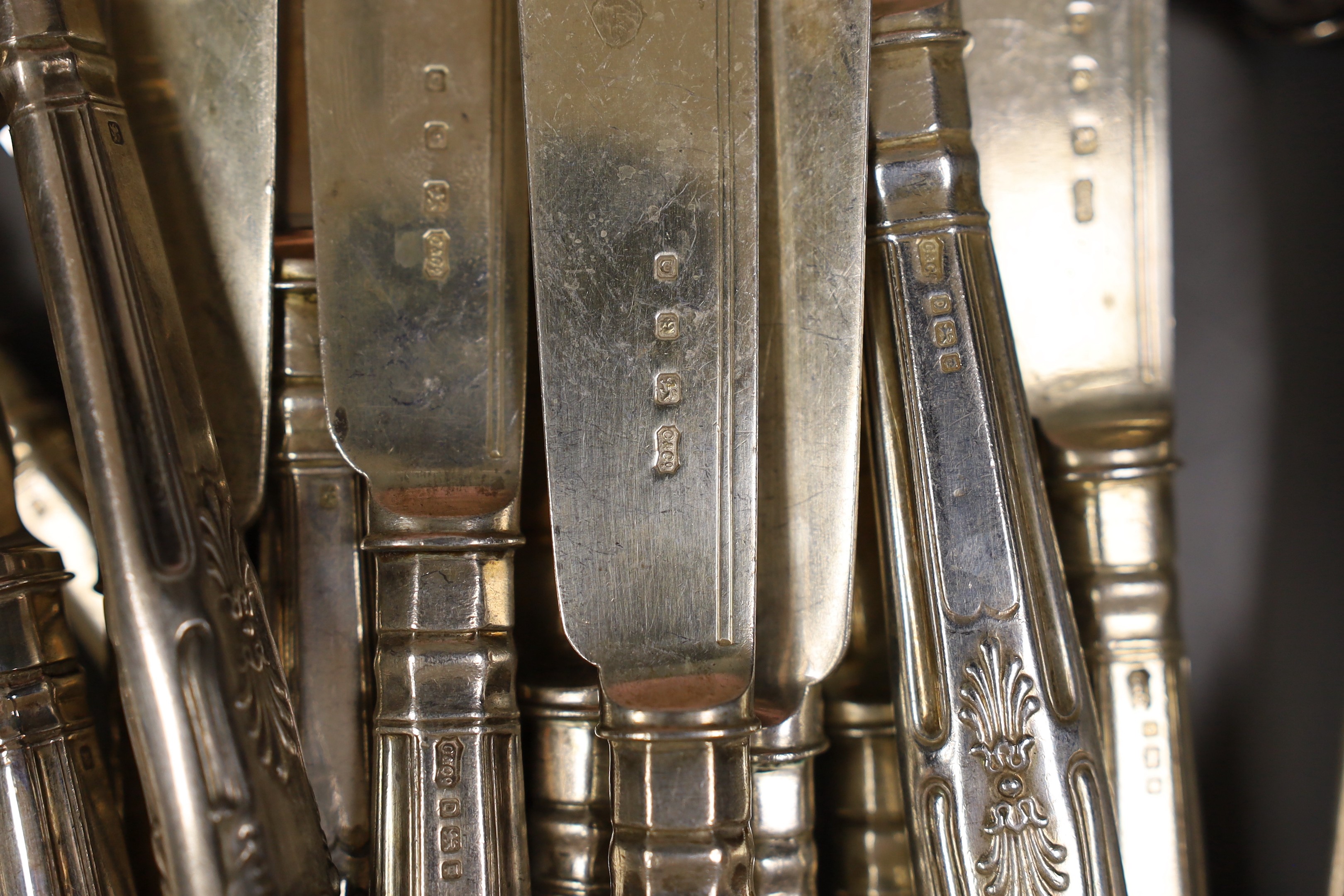A pair of George VI silver fish servers, Carrington & Co, London 1939 and eleven pairs of matching fish eaters, together with a continental white metal skewer, a modern silver handled cake slice and cheese knife, a lady'